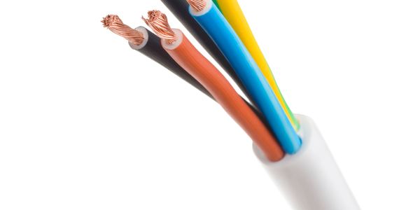 Close-up of a multi-colored electrical cable with exposed copper wires.