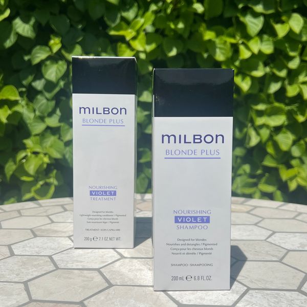 Milbon Blonde Plus Nourishing Violet shampoo and treatment boxes displayed outdoors.