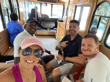 Friends riding on a trolley