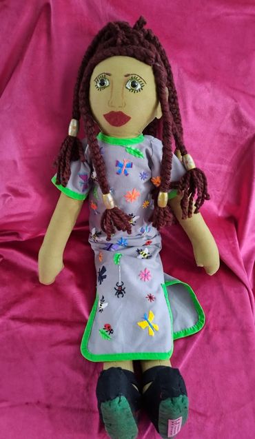 Mixed race doll in original embroidered dress: handmade/ hand sewn.