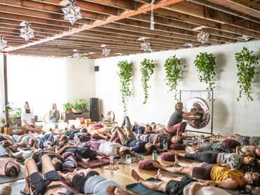 Participants enjoying a group breathwork and sound healing session