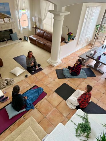Small-group breathwork class practicing breathing techniques