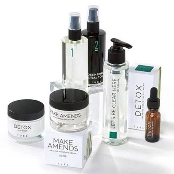 Skincare products arranged on white background.