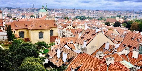 A panoramic view of Prague, Czechia with terracotta rooftops.
