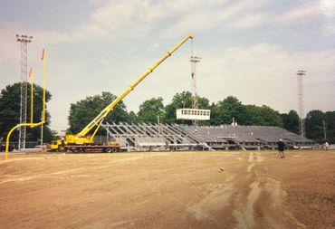 Setting Alumni Field press boxes, 2000's