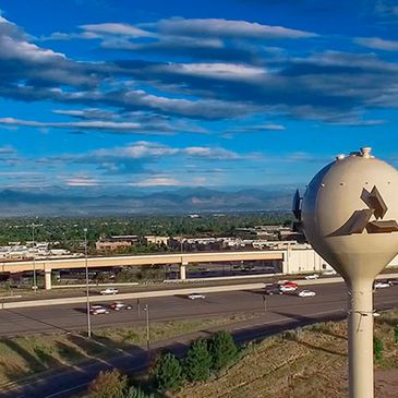Image of the Inerness water tower near I-25 and Dry Creek Rd wtih the Inverness logo on it. 
