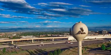 Image of the water tower off I-25 and Dry Creek in the Inverness Metro District.  Tower has the Inve
