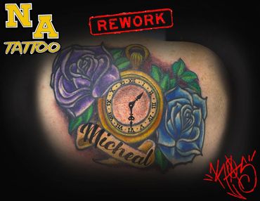 Colorful tattoo with roses, a clock, and the name Micheal.