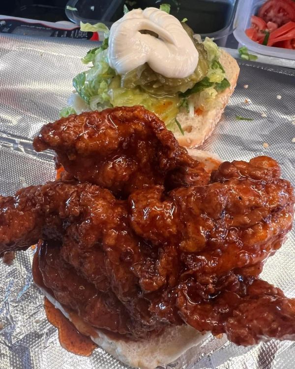 Spicy fried chicken sandwich with pickles and mayo.
