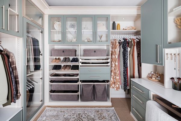 Master Walk In Closet in Arctic with Spruce Doors and Drawers & pullout drawers and laundry hamper