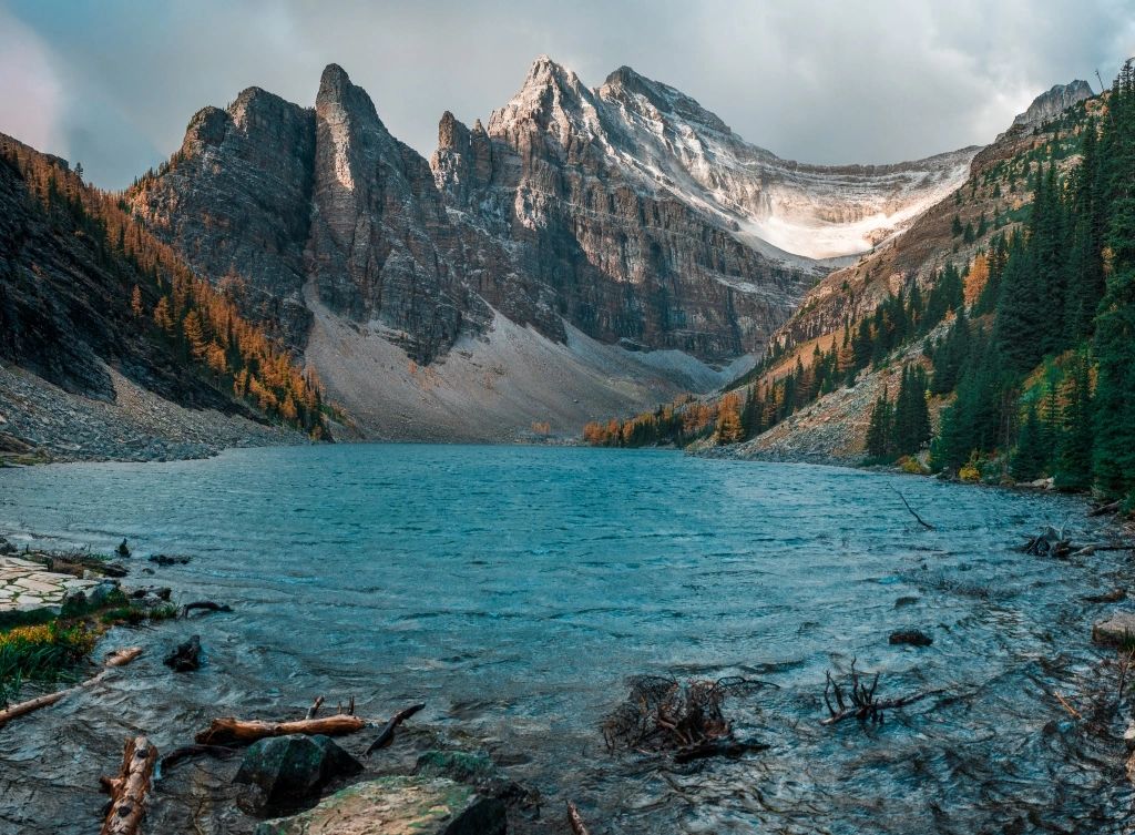 A lake that is at the peak of a mountain in the Canadian Rockies.
