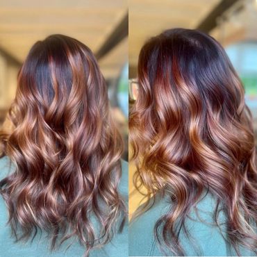 Beautiful wavy hair with rich brown and caramel highlights.