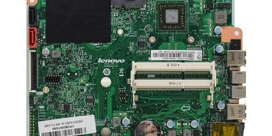 Close-up of a Lenovo computer motherboard with various components.