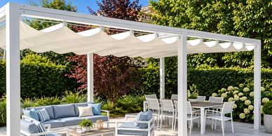 Modern outdoor patio with white pergola and seating.