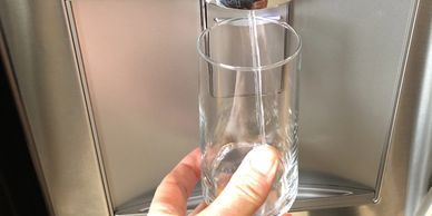 Reverse-osmosis filtered water coming out of the fridge.