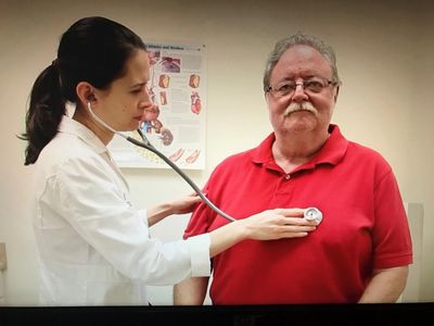 Clinic director Abigail Bivens, PAC, with a patient