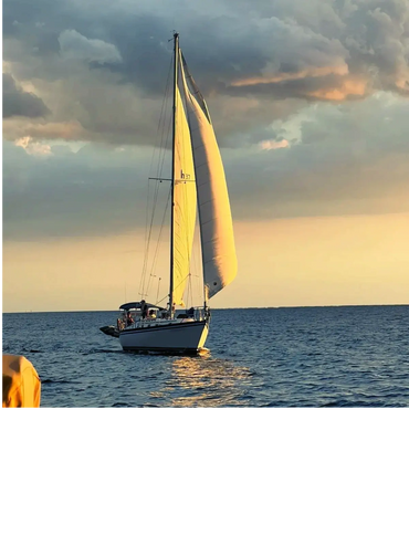 Courageous sailboat sailing toward home port in Port Charlotte on the Gulf of America.