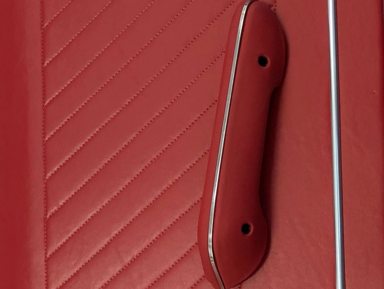Red vinyl door panel with stiching