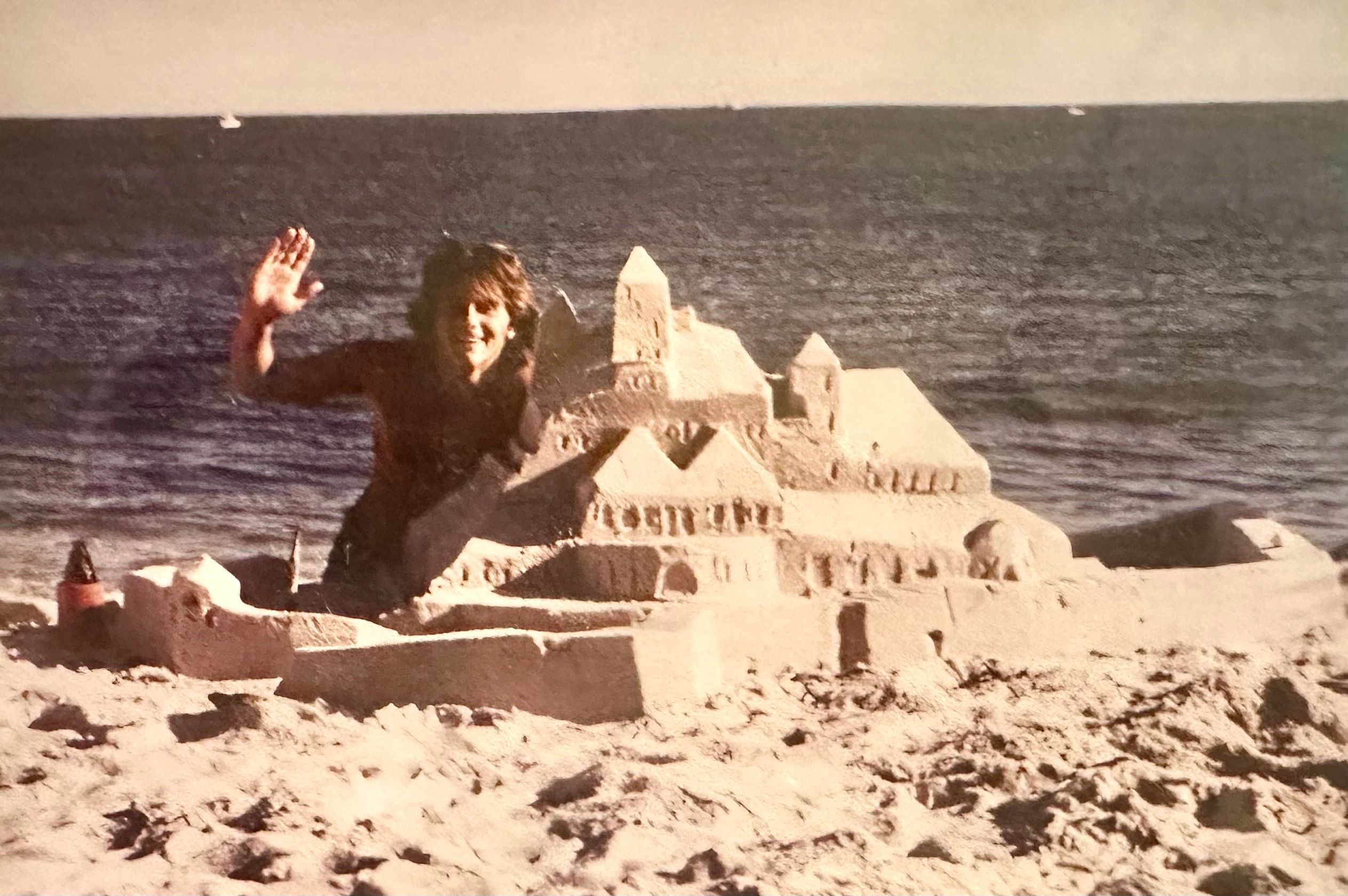 Scotty Dodson in classic photo building one of his very early sandcastles on Robert Mosses State Bea