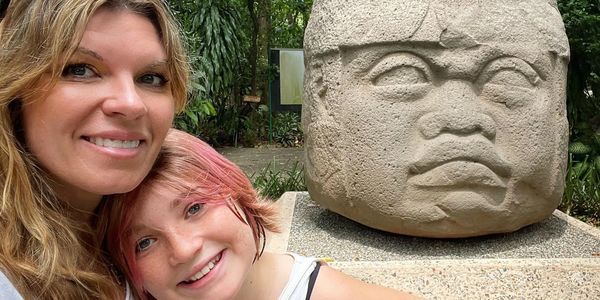 In Mexico with my daughter and an Olmec megalith statue