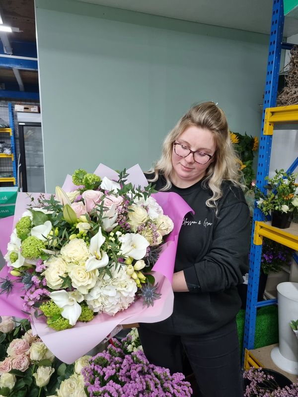 Rachel holding a flower bouquet