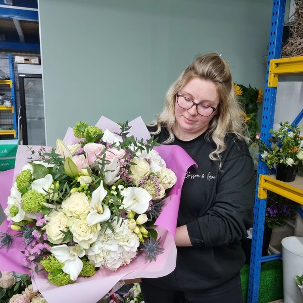 Rachel holding a flower bouquet