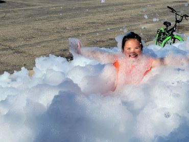 Young child smiling and jumping for joy!
