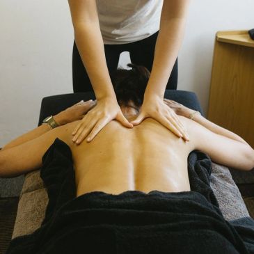 Person receiving a back massage.