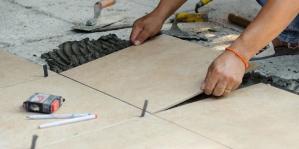 person laying tile