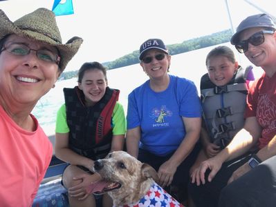 Shelter dog and volunteers from the Humane Society of Northeast Georgia on the Pooch Pontoon
