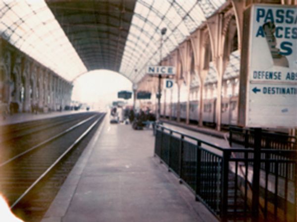 Image of Nice station from a polaroid shot of it; tracks recede from POV and disappear into distance