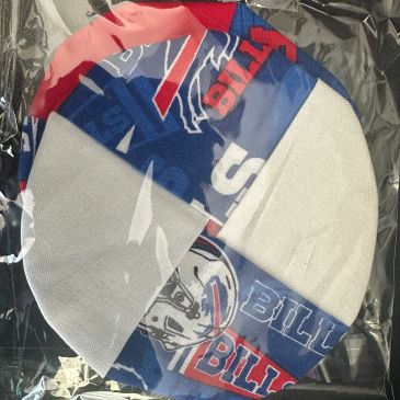 Two Buffalo Bills face masks in plastic packaging.