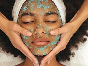 A woman applying cream and facial Of the fish