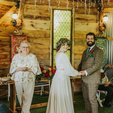 Bride and groom smiling at their wedding ceremony.