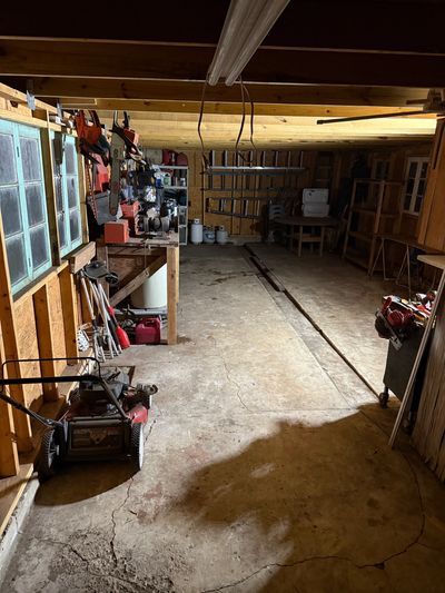 Garage workshop with tools and equipment.