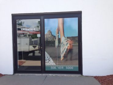 Vinyl graphics applied to windows. View through. Physical Therapist storefront, Shrewsbury, MA