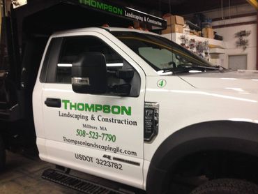Truck lettering with vinyl graphics. Thompson Landscaping, Millbury, MA