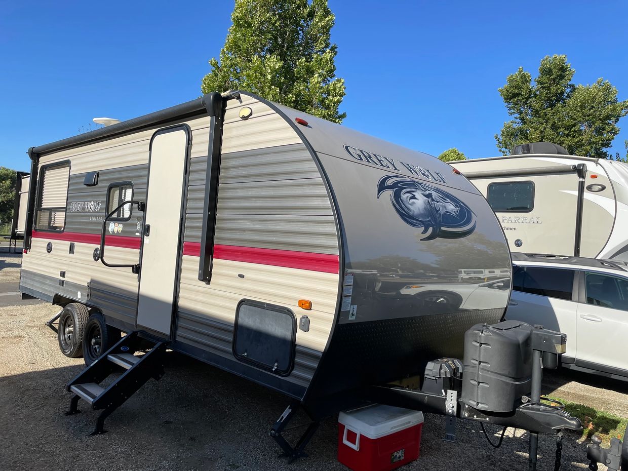This is a 24 foot trailer with a four seat dinette table, sofa, kitchen and bathroom.