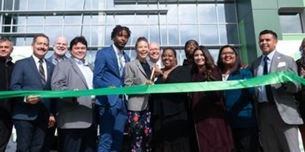 Ribbon-cutting ceremony for the grand opening of a new diverse nonprofit organization