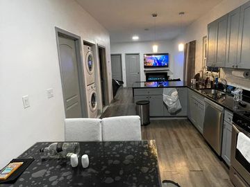 Completed kitchen remodel with new flooring, cabinetry, and open layout