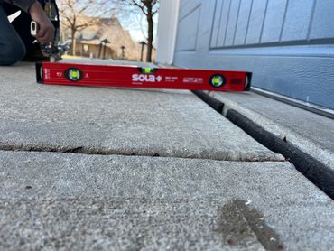 Lifting the driveway to match the garage floor