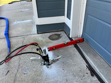 Leveling the driveway entering the garage in Lee Summit, MO