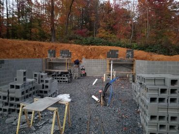 Excavated Foundation showing foundation walls being erected.