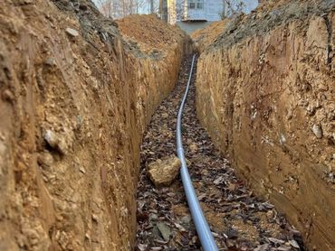 excavated ditch for water lines and geothermal heat pump water lines.
