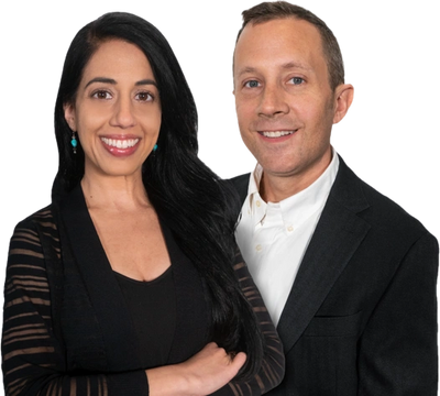 Aaron Polk and Jasmine Shammay at their Brookhaven office — top North Atlanta luxury homes agency.
