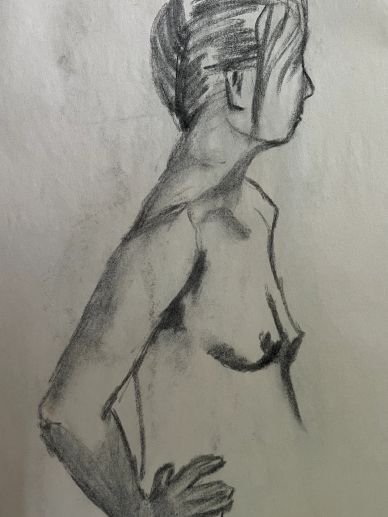 Charcoal sketch of a woman in profile with her hand on her hip.