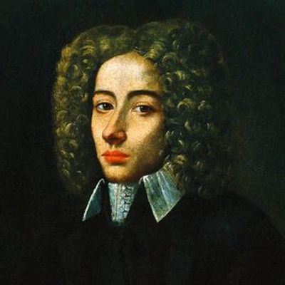 Portrait of a man with curly hair and a formal collar.