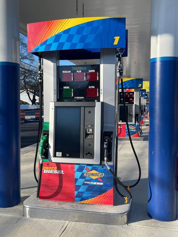 Sunoco gas station pump with multiple fuel options.