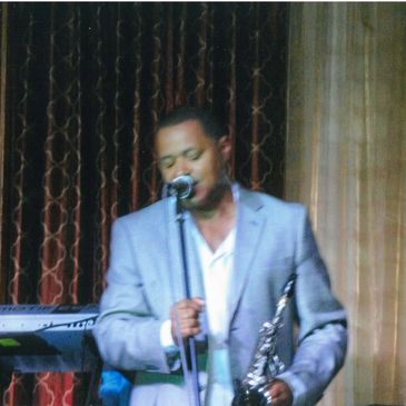 A Person in a Blue Suit in Front of a Mike