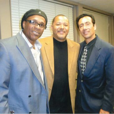 A Group of Three Posing for a Photo